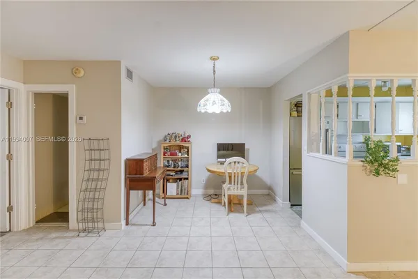 a view of kitchen with furniture and chandelier