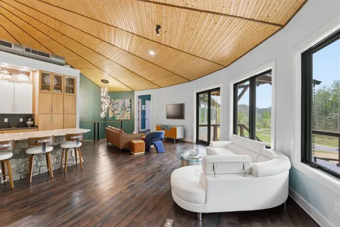 a kitchen with stainless steel appliances granite countertop a sink a stove and a refrigerator