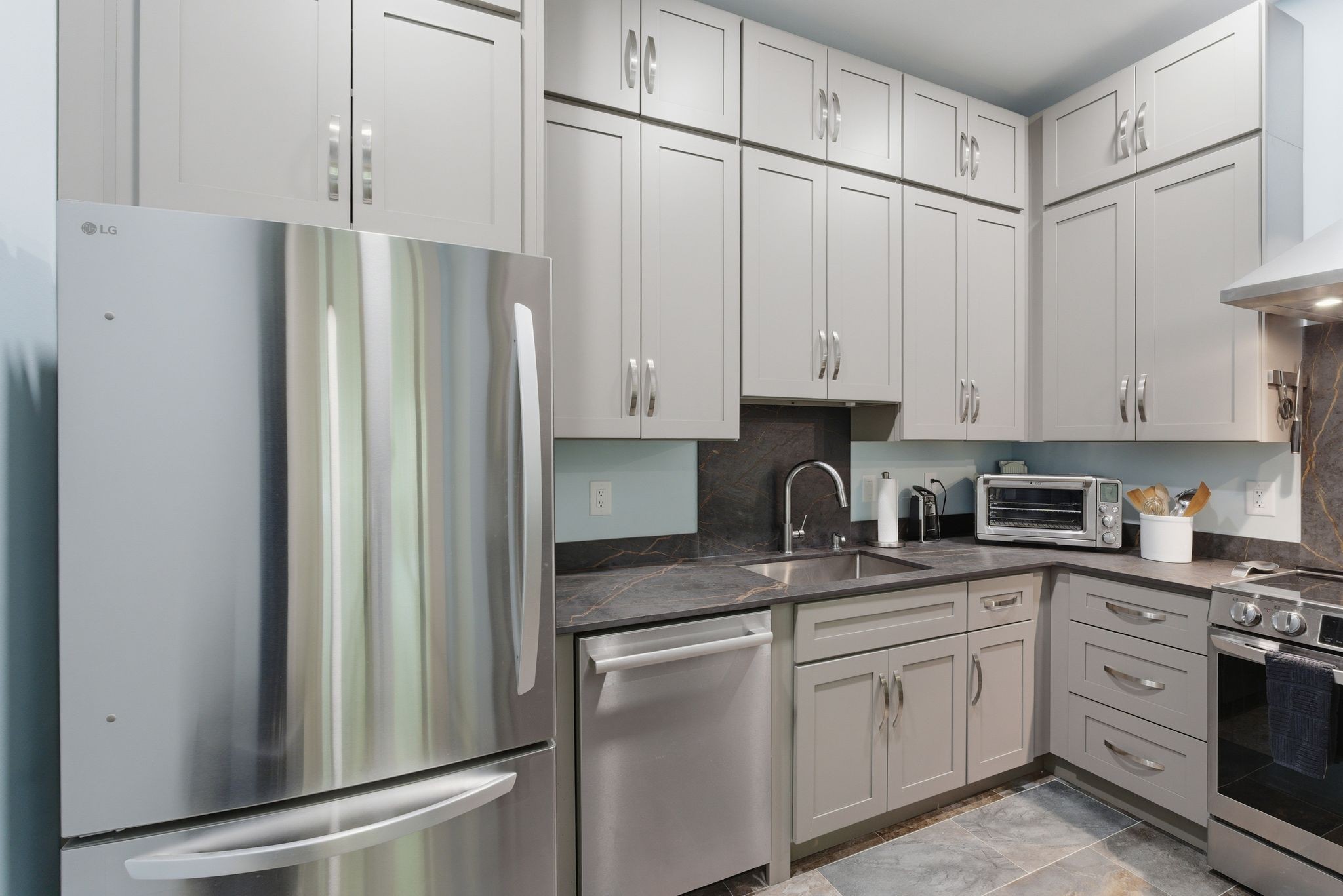 1751 Cayce Springs Road Thompson's Station, TN 37179 - Photo 16 of 86 a kitchen with stainless steel appliances granite countertop a refrigerator sink and cabinets