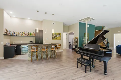 a bedroom with two beds and a large window
