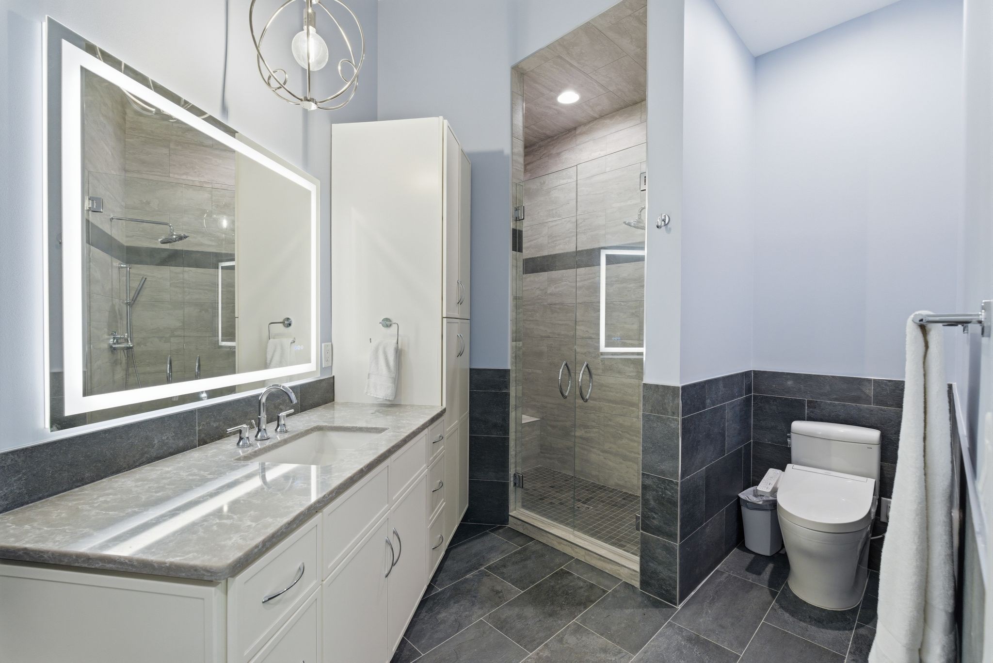 1751 Cayce Springs Road Thompson's Station, TN 37179 - Photo 40 of 86 a bathroom with a granite countertop sink a toilet a mirror and shower
