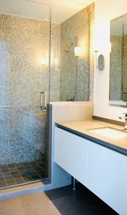 68 Southeast 6th Street, Unit 2702 Miami, FL 33131 - Photo 8 of 28 a bathroom with a bathtub and shower