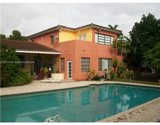 5205 Alton Road Miami Beach, FL 33140 - Photo 1 of 16 a house view with swimming pool and sitting space