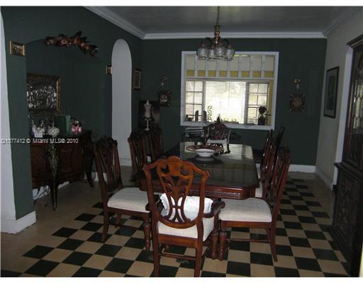 5205 Alton Road Miami Beach, FL 33140 - Photo 5 of 16 a view of a dining room with furniture