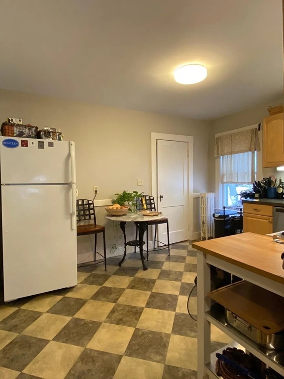 7 High Street, Unit 1 Somerville, MA 02144 - Photo 13 of 13 a kitchen with a sink a refrigerator and a stove top oven