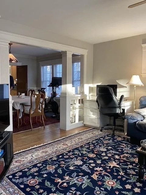 7 High Street, Unit 1 Somerville, MA 02144 - Photo 6 of 13 a living room with furniture a rug and a fireplace