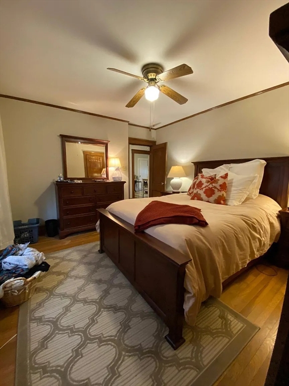 7 High Street, Unit 1 Somerville, MA 02144 - Photo 8 of 13 a bedroom with a bed and ceiling fan