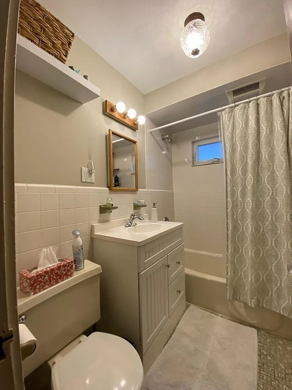 7 High Street, Unit 1 Somerville, MA 02144 - Photo 9 of 13 a bathroom with a sink toilet and shower