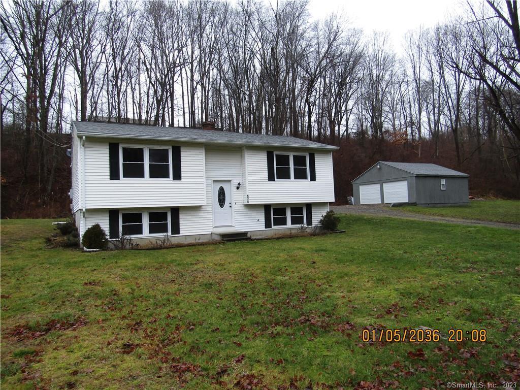 576 Valley Road Killingly, CT 06241 - Photo 1 of 1 a white house that has a tree in front of the house