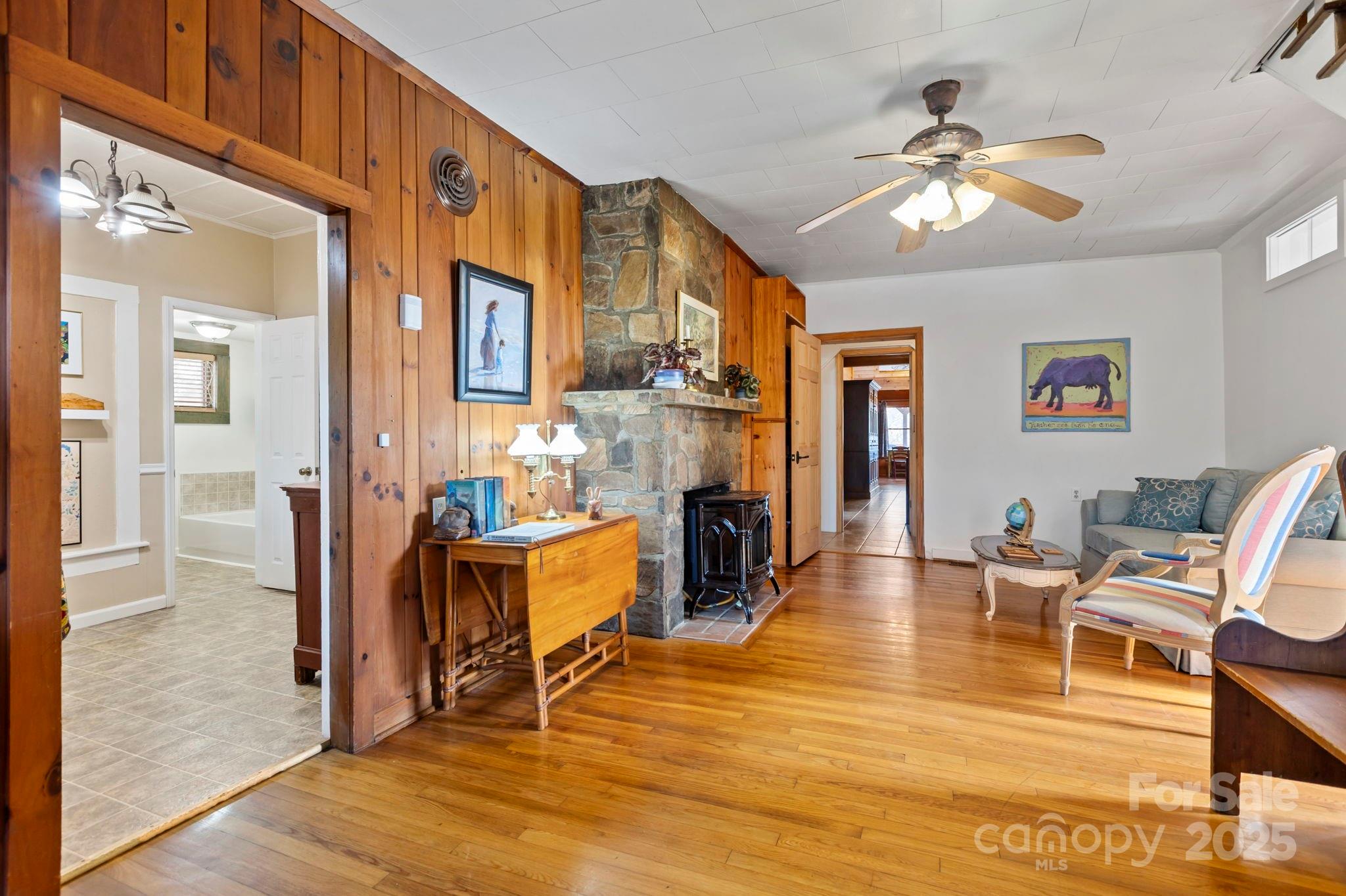 104 Enthoffer Road Black Mountain, NC 28711 - Photo 12 of 42 a living room with fireplace furniture and a wooden floor