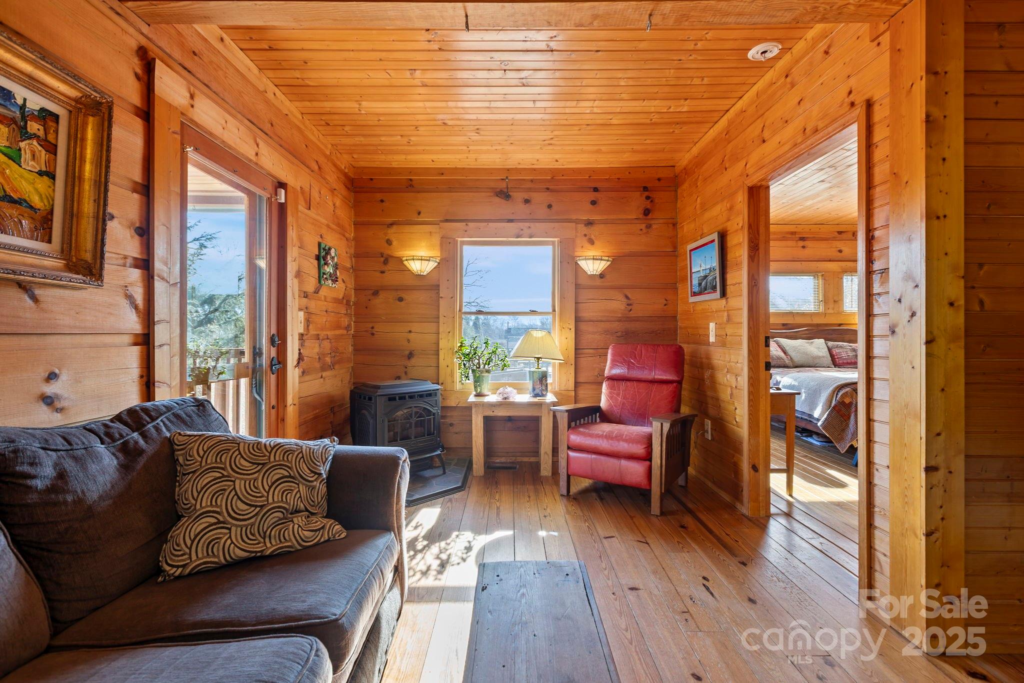 104 Enthoffer Road Black Mountain, NC 28711 - Photo 17 of 42 a living room with furniture and a large window