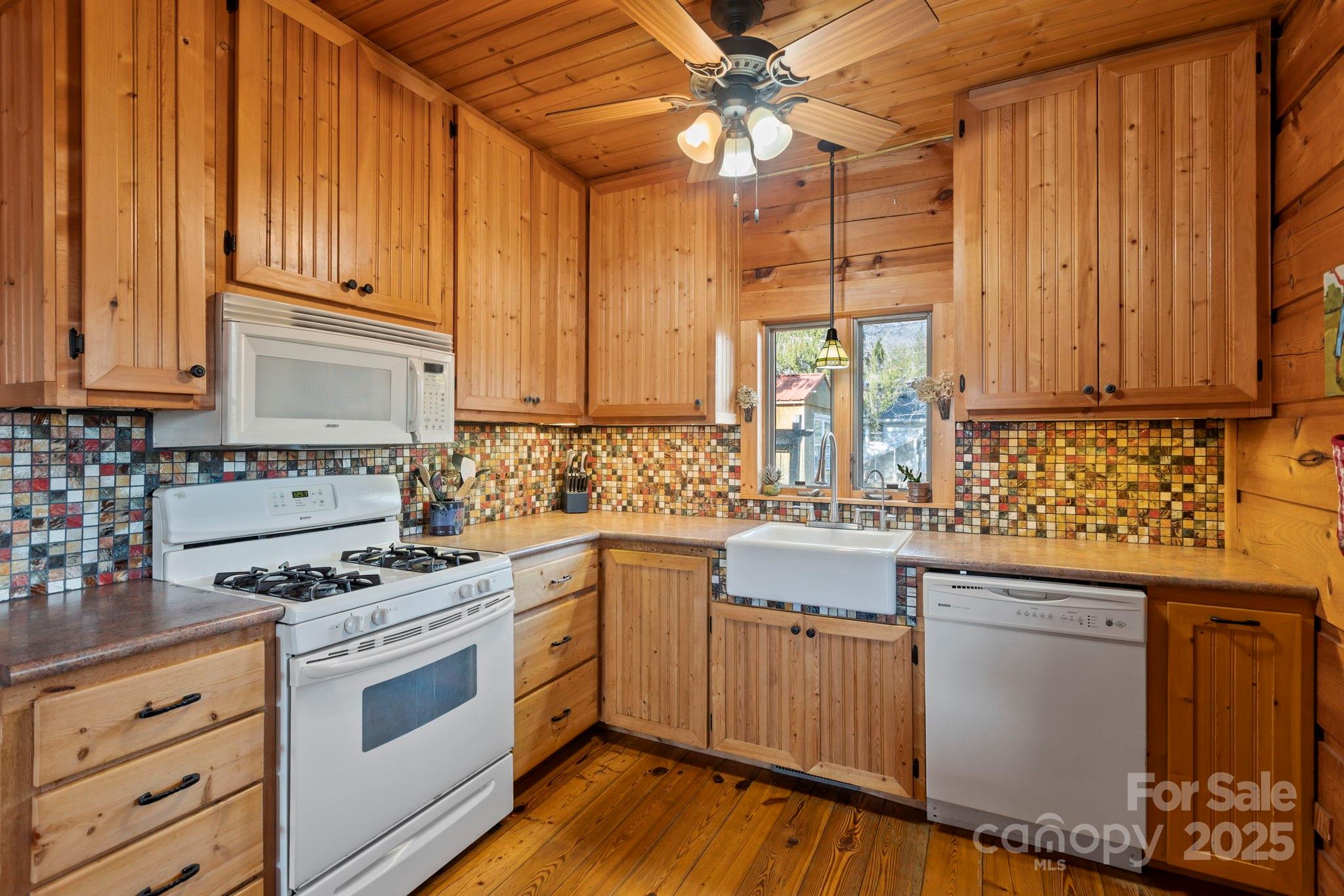 104 Enthoffer Road Black Mountain, NC 28711 - Photo 20 of 42 a kitchen with granite countertop a sink stainless steel appliances and cabinets