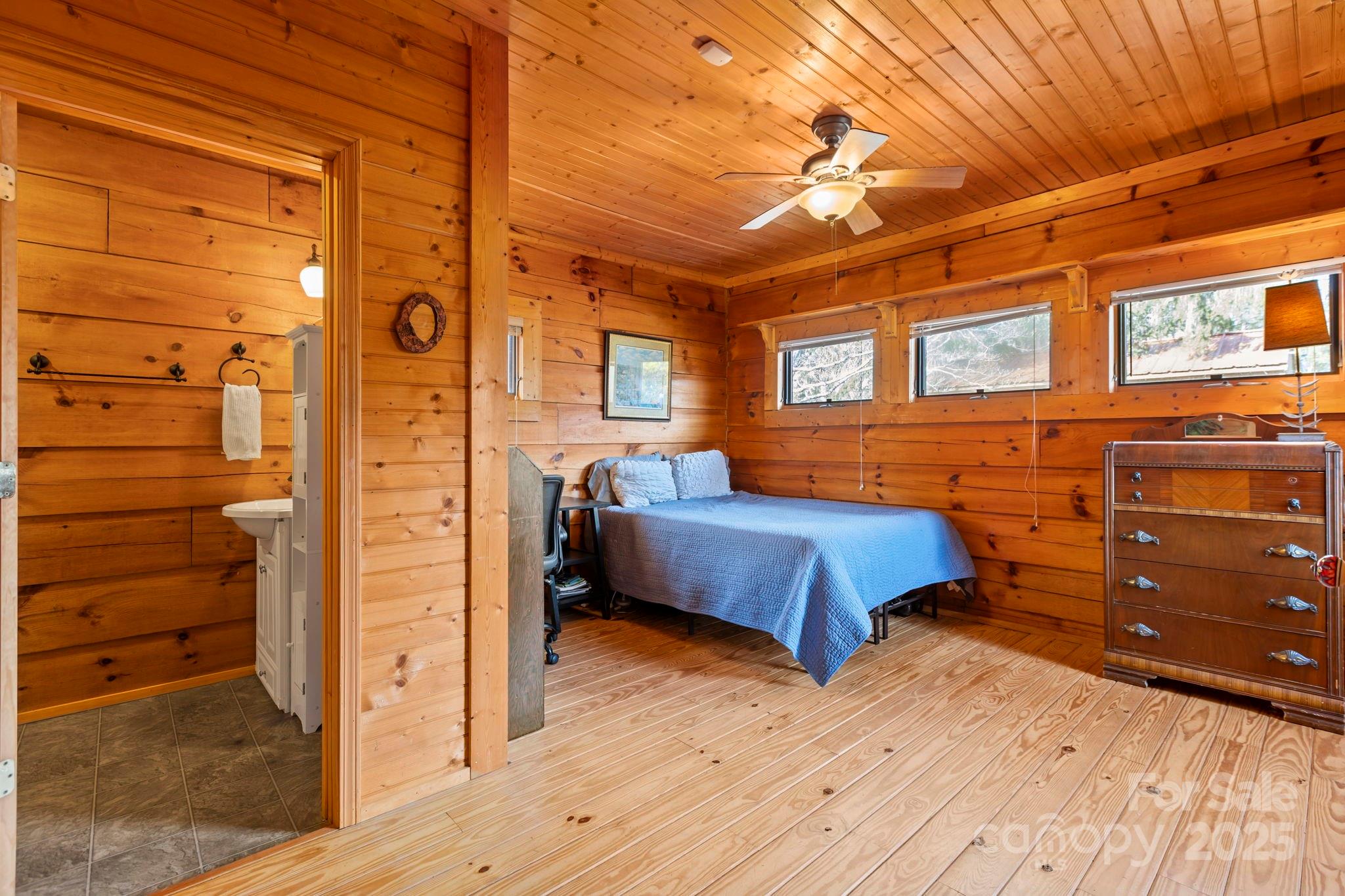 104 Enthoffer Road Black Mountain, NC 28711 - Photo 21 of 42 a bedroom with a bed and a dresser