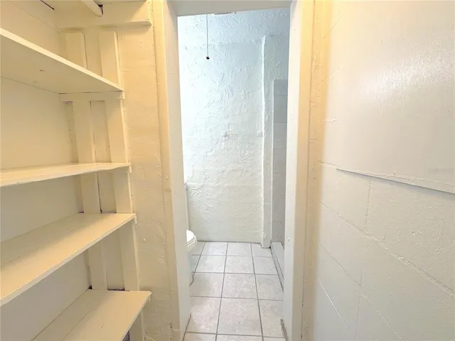 a bathroom with a shower and a sink