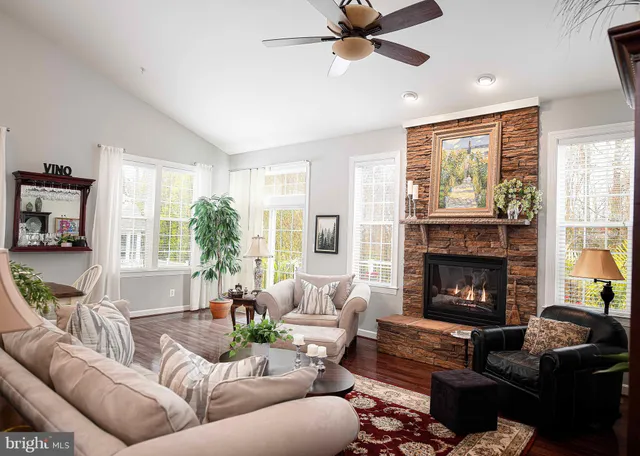 a bedroom with two beds and a chandelier