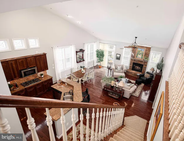 a living room with furniture and a lamp