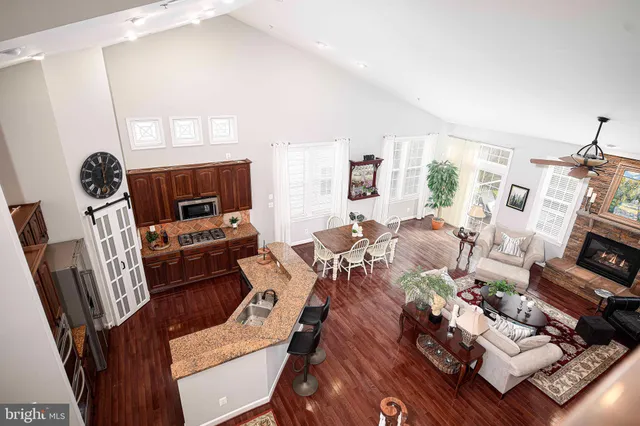 a bedroom with a large bed and a flat tv screen