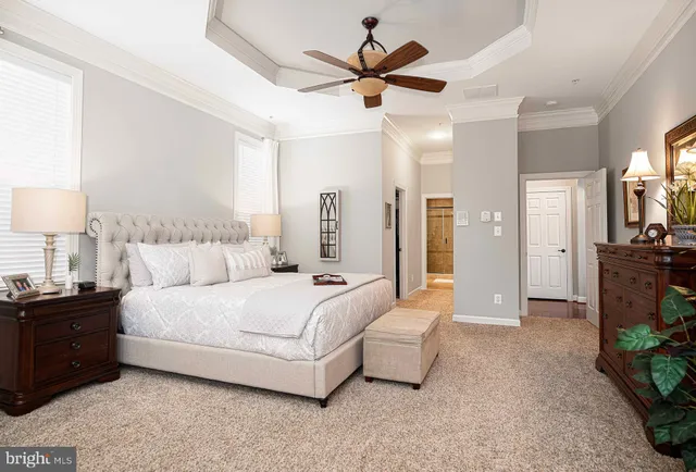 a bathroom with a granite countertop toilet a sink and a bathtub