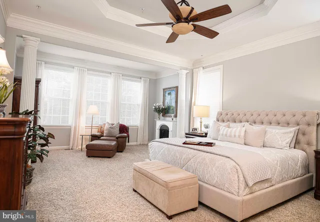 a living room with furniture kitchen view and a window