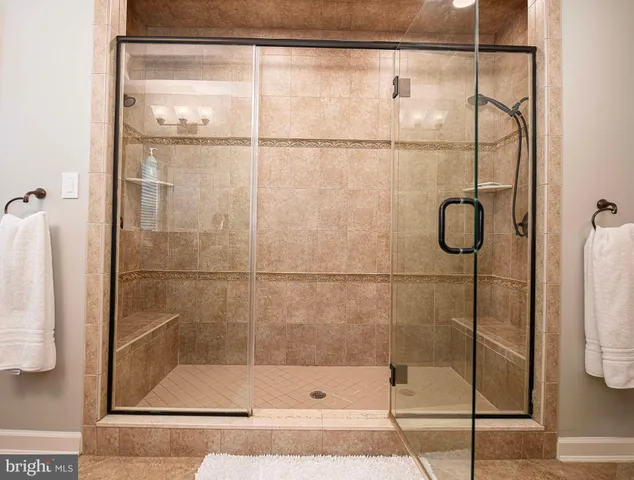 a kitchen with stainless steel appliances granite countertop a stove a sink dishwasher and cabinets with wooden floor