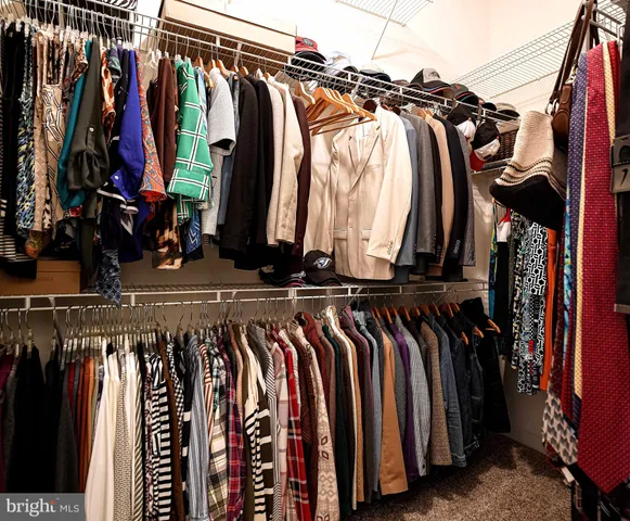 a view of a livingroom with workspace and a couch