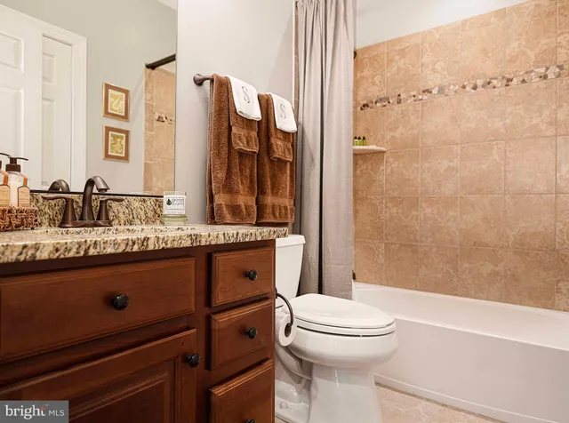 a building outdoor space with patio furniture and potted plants