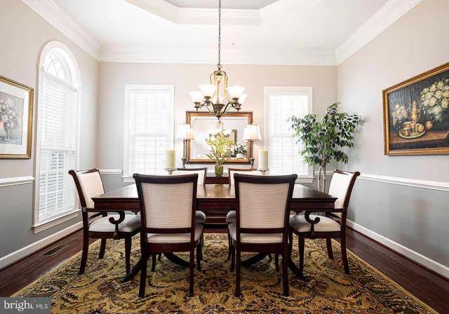 a kitchen with stainless steel appliances granite countertop a refrigerator a stove and a sink