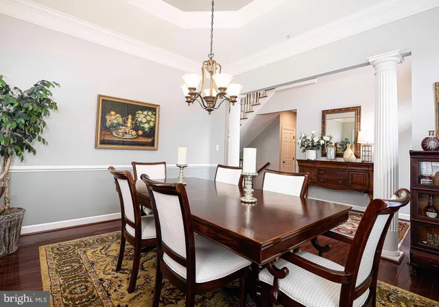 a living room with furniture fireplace and a large window
