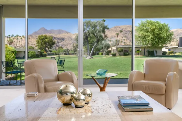 a outdoor living space with furniture and garden view