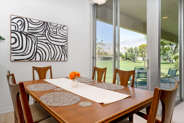 a view of a dining room with furniture window and outside view
