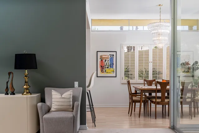 a view of a dining room with furniture window and outside view