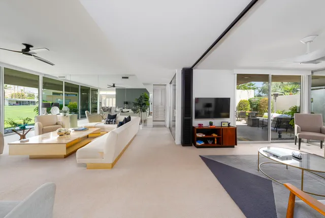 a view of living room with furniture and a flat screen tv