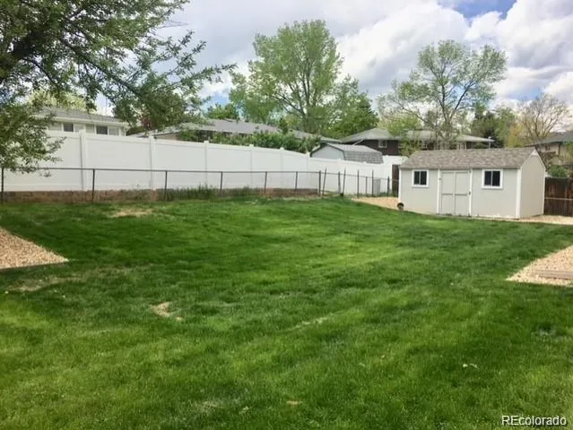 a view of backyard with green space