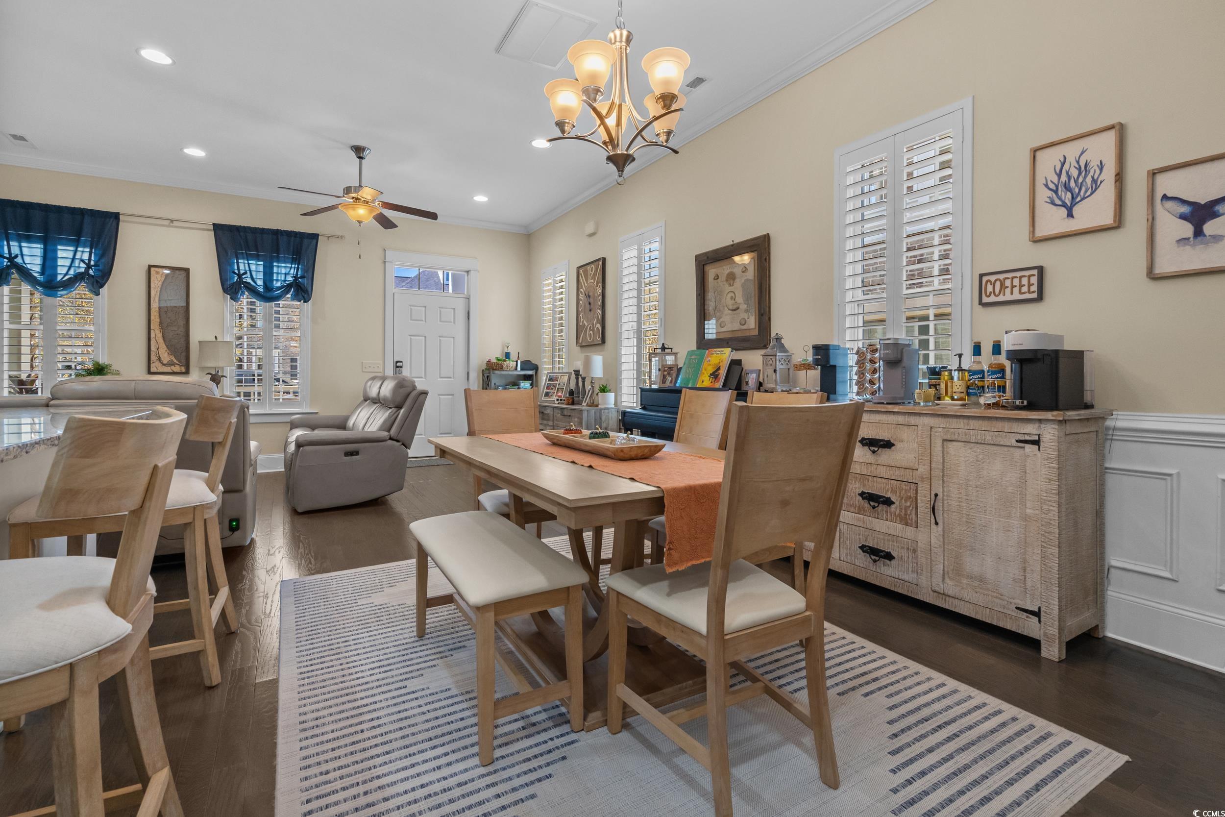 2794E Howard Avenue, Unit A Myrtle Beach, SC 29577 - Photo 11 of 40 Dining space featuring ornamental molding, recessed lighting, a chandelier, dark wood-style floors, and ceiling fan