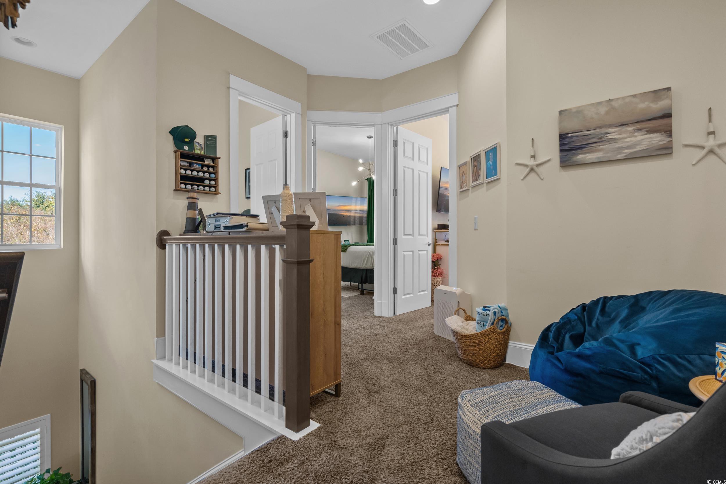 2794E Howard Avenue, Unit A Myrtle Beach, SC 29577 - Photo 15 of 40 Corridor with carpet floors and baseboards