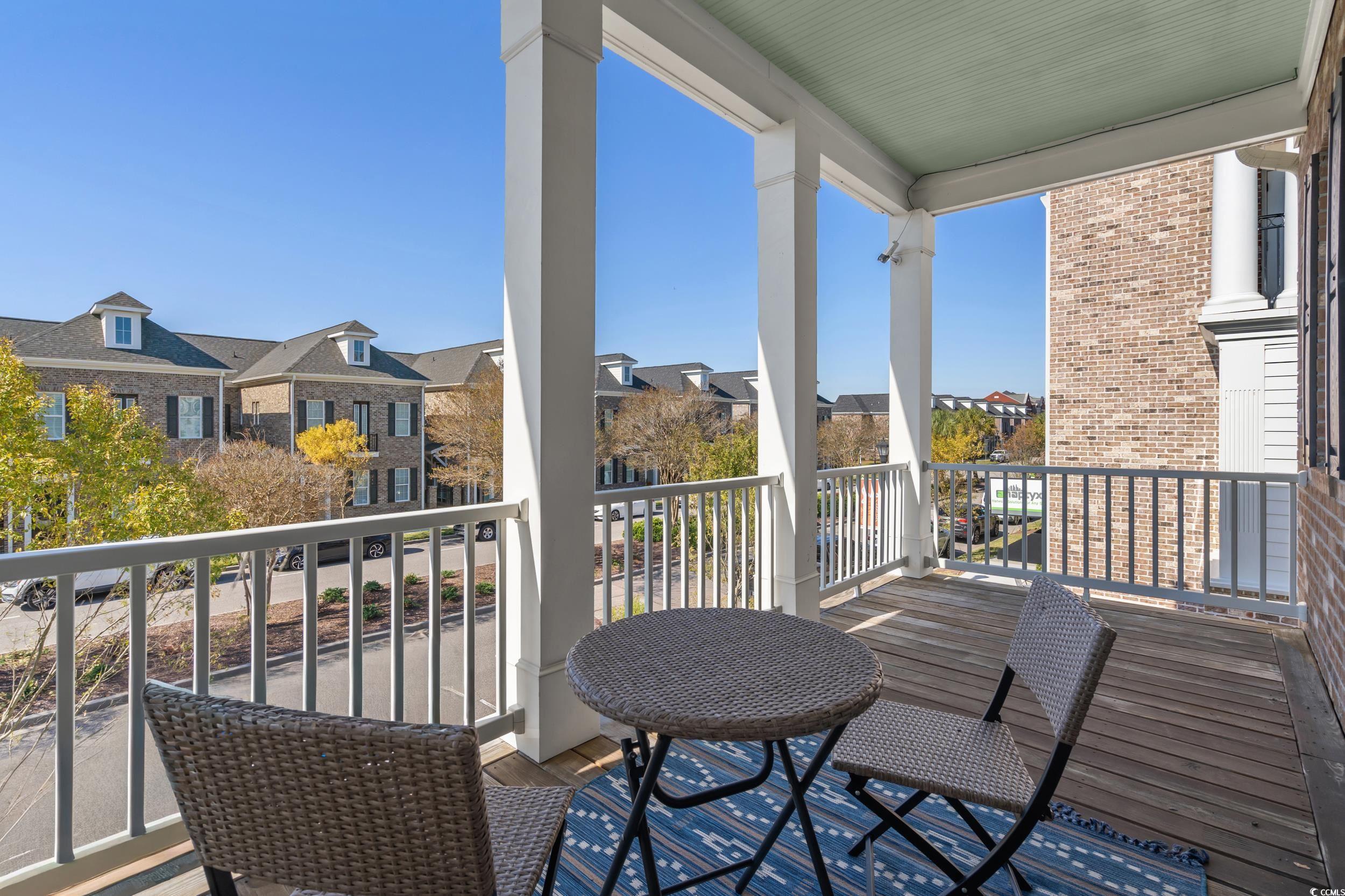 2794E Howard Avenue, Unit A Myrtle Beach, SC 29577 - Photo 22 of 40 Balcony featuring a residential view and a sunroom
