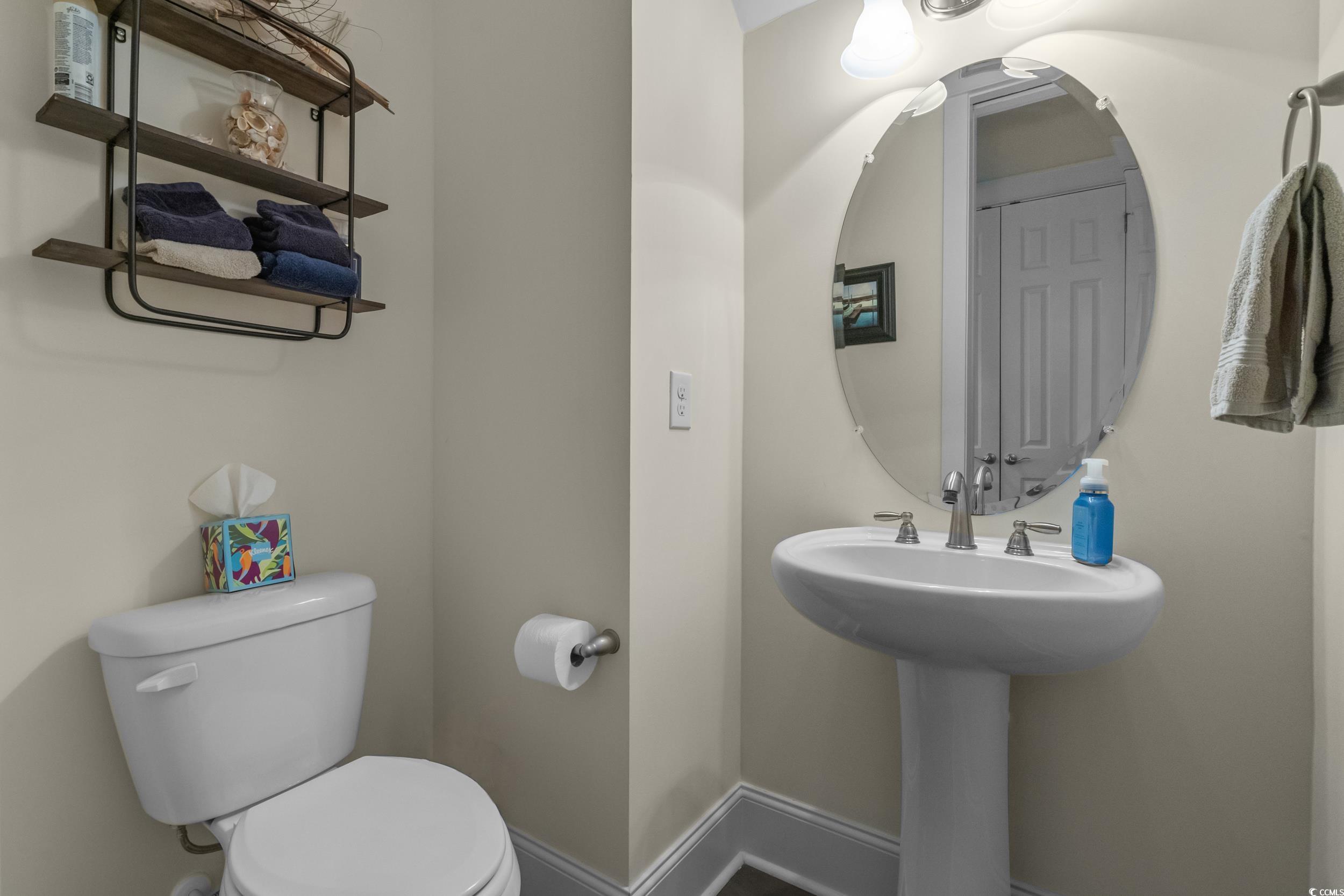 2794E Howard Avenue, Unit A Myrtle Beach, SC 29577 - Photo 27 of 40 Half bath featuring baseboards and toilet