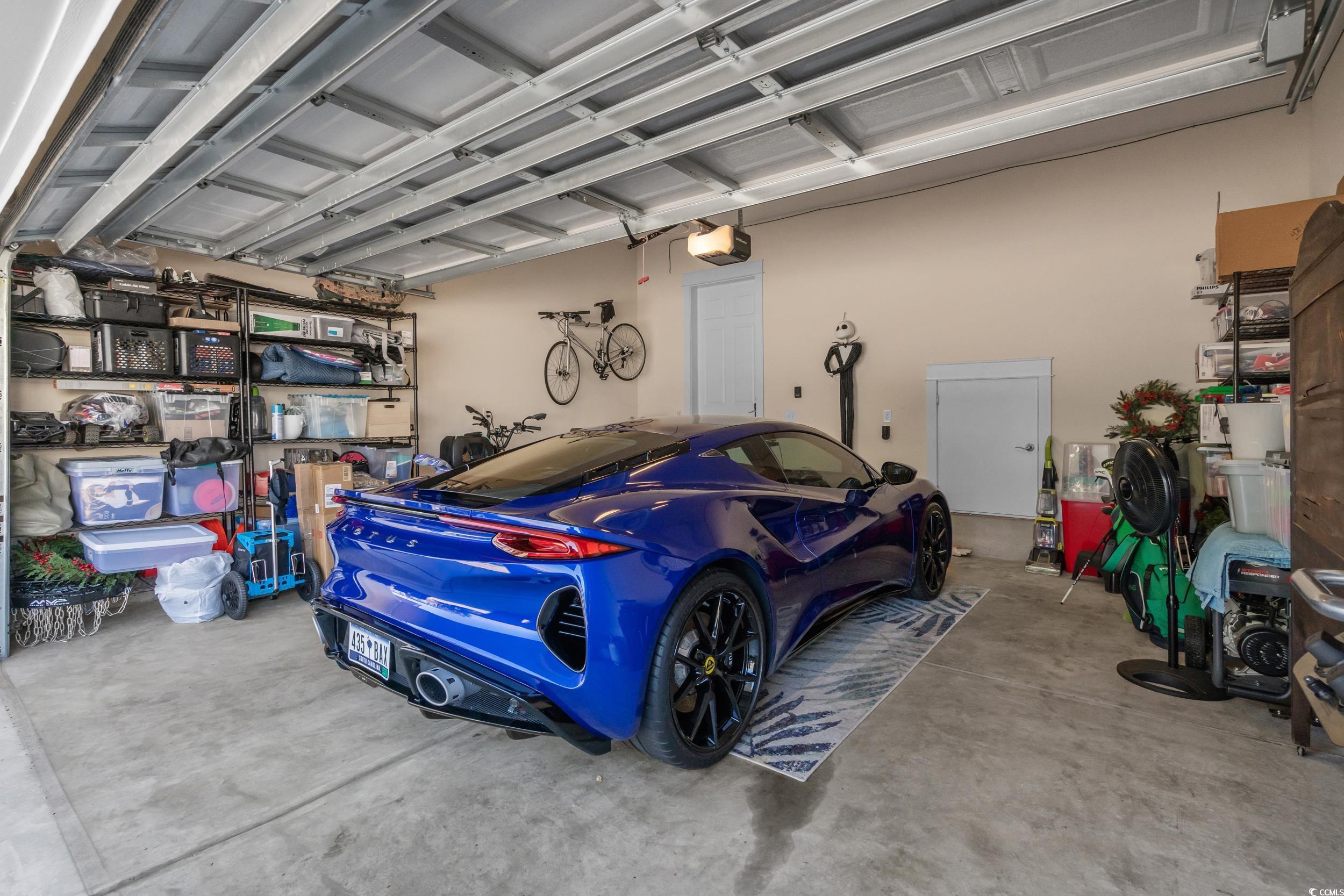 2794E Howard Avenue, Unit A Myrtle Beach, SC 29577 - Photo 29 of 40 Garage with a garage door opener