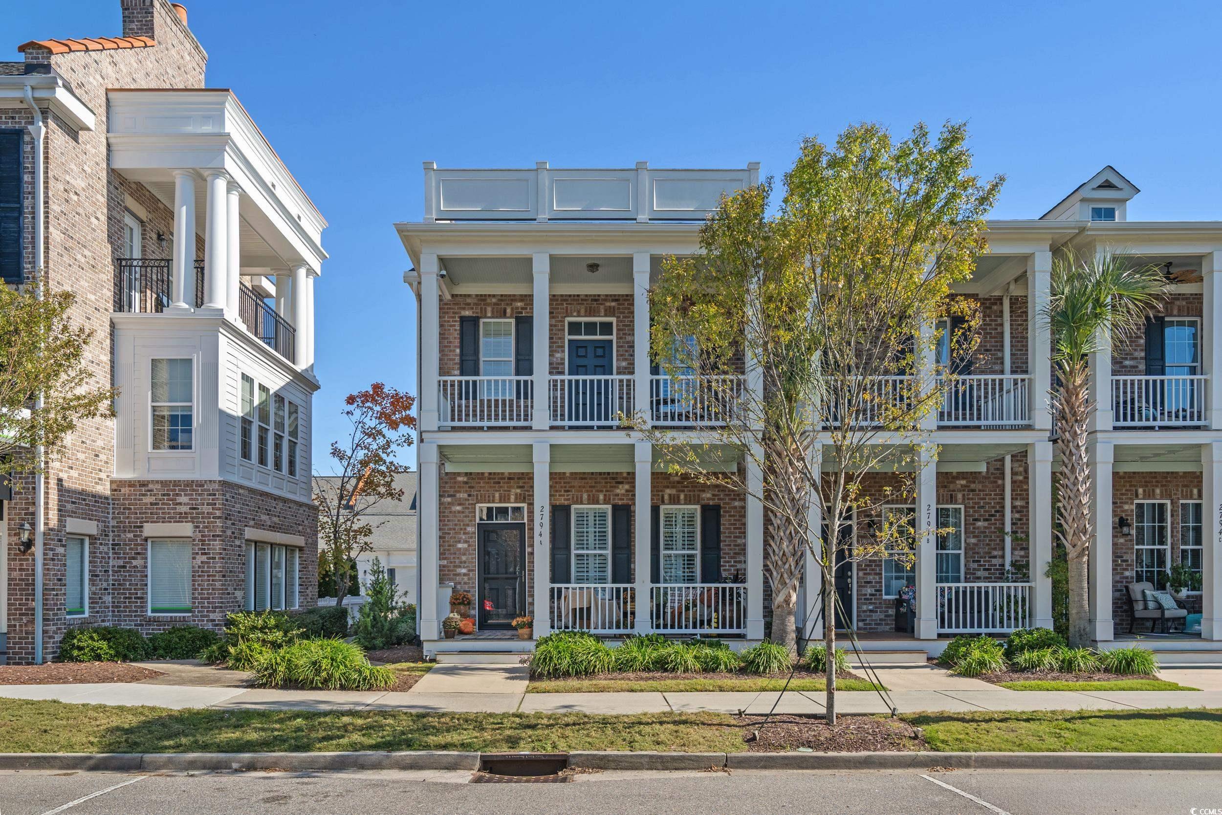 2794E Howard Avenue, Unit A Myrtle Beach, SC 29577 - Photo 33 of 40 Greek revival house with brick siding and a porch