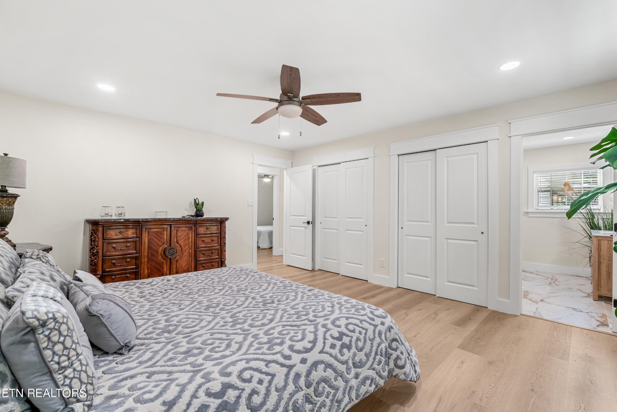 337 Farmer's Hollow Road Clinton, TN 37716 - Photo 27 of 49 a bedroom with a bed and a chandelier