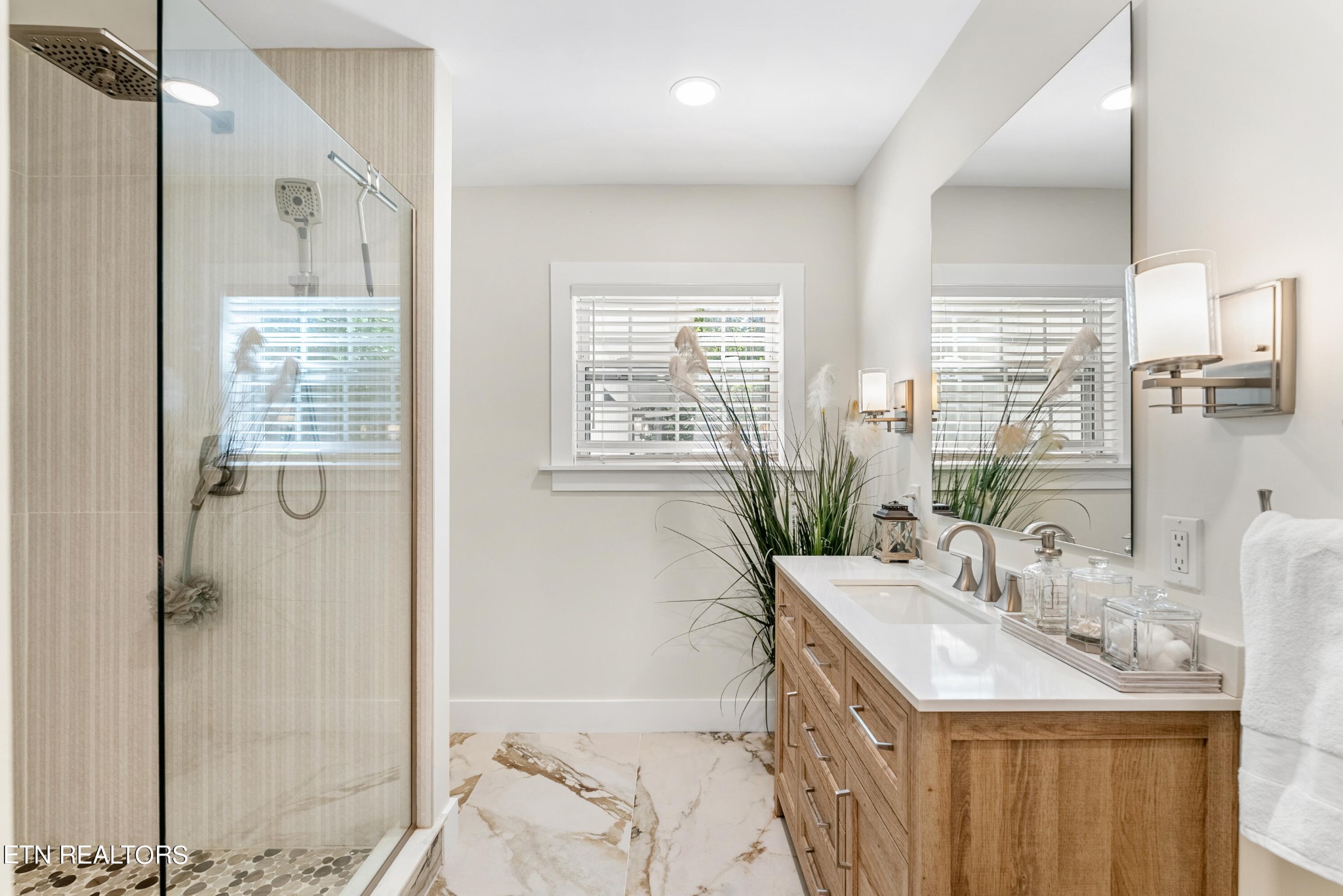 337 Farmer's Hollow Road Clinton, TN 37716 - Photo 28 of 49 a bathroom with a granite countertop sink a mirror and a shower