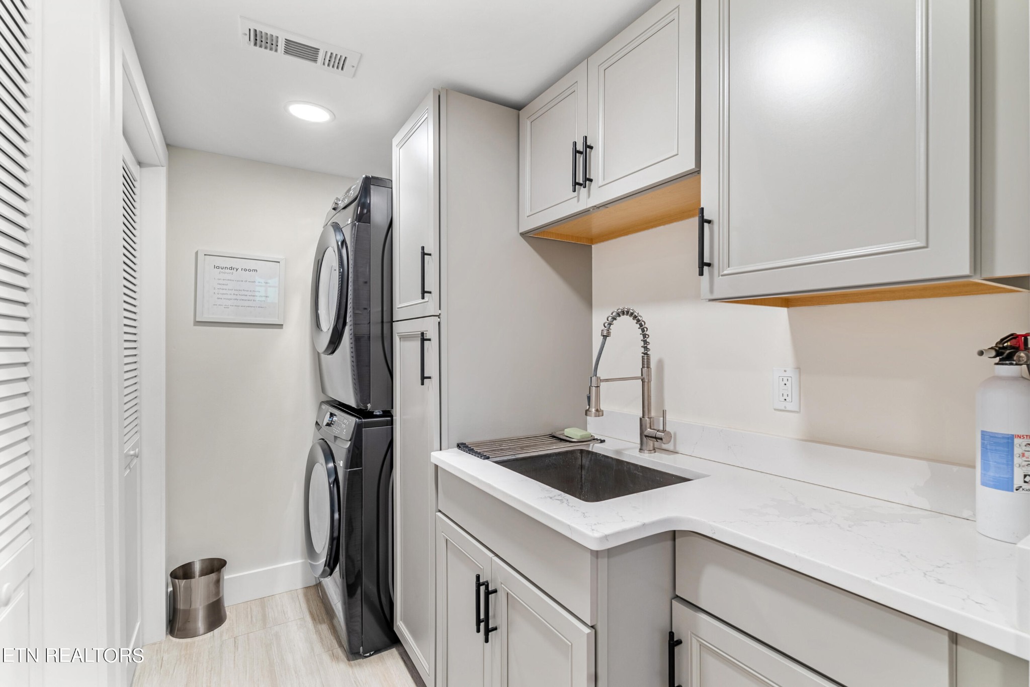 337 Farmer's Hollow Road Clinton, TN 37716 - Photo 40 of 49 a kitchen with a refrigerator and a sink