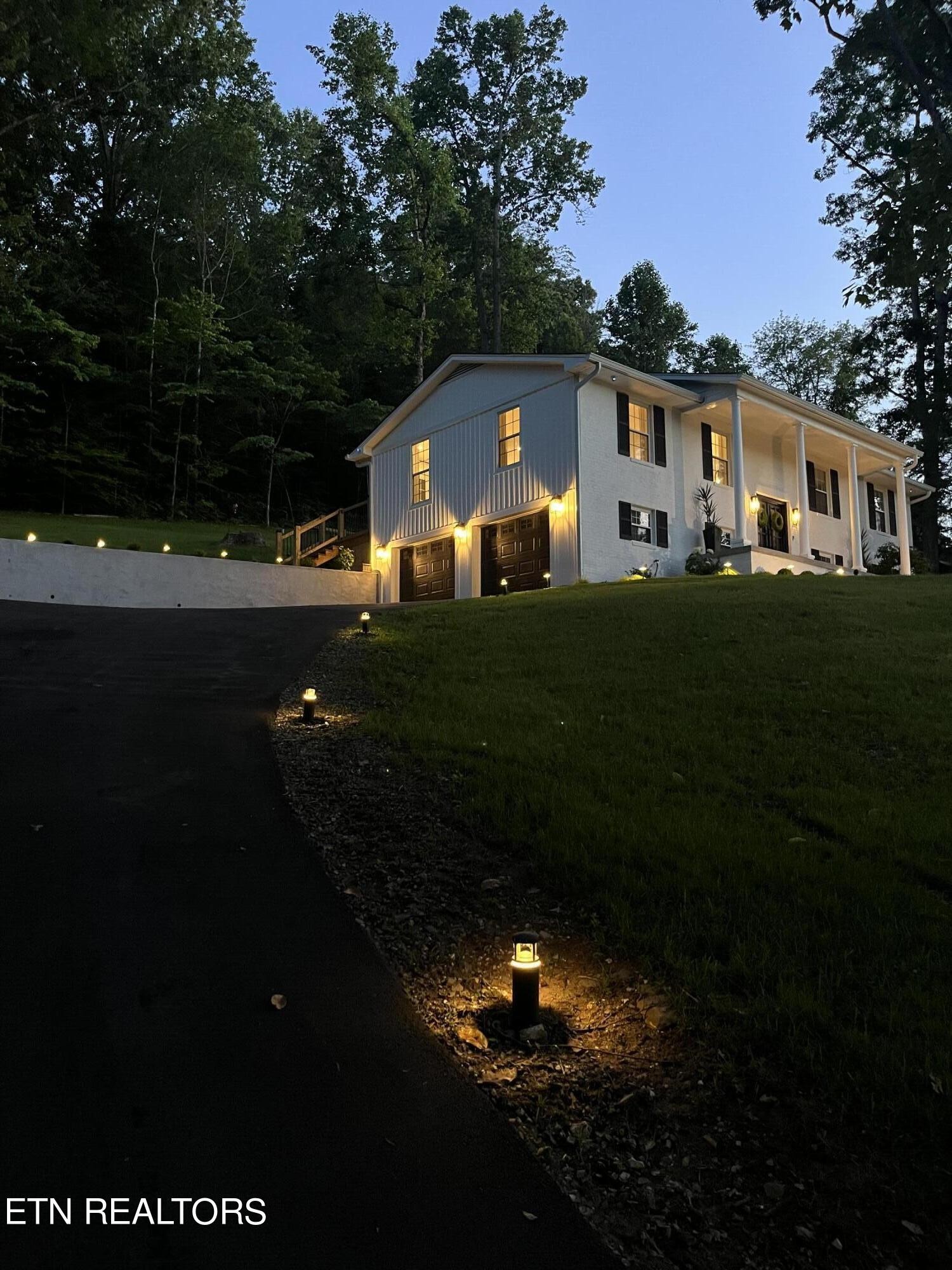 337 Farmer's Hollow Road Clinton, TN 37716 - Photo 46 of 49 a front view of a house with a garden
