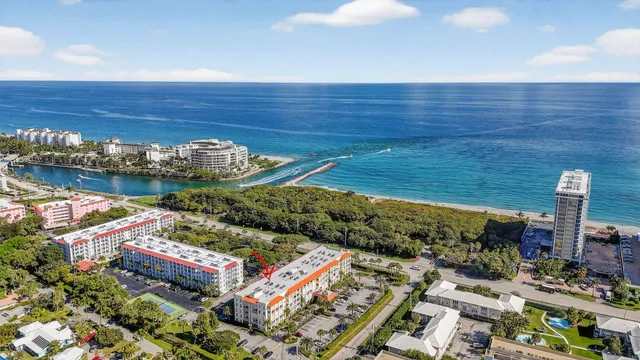 an aerial view of a tennis ground with large trees