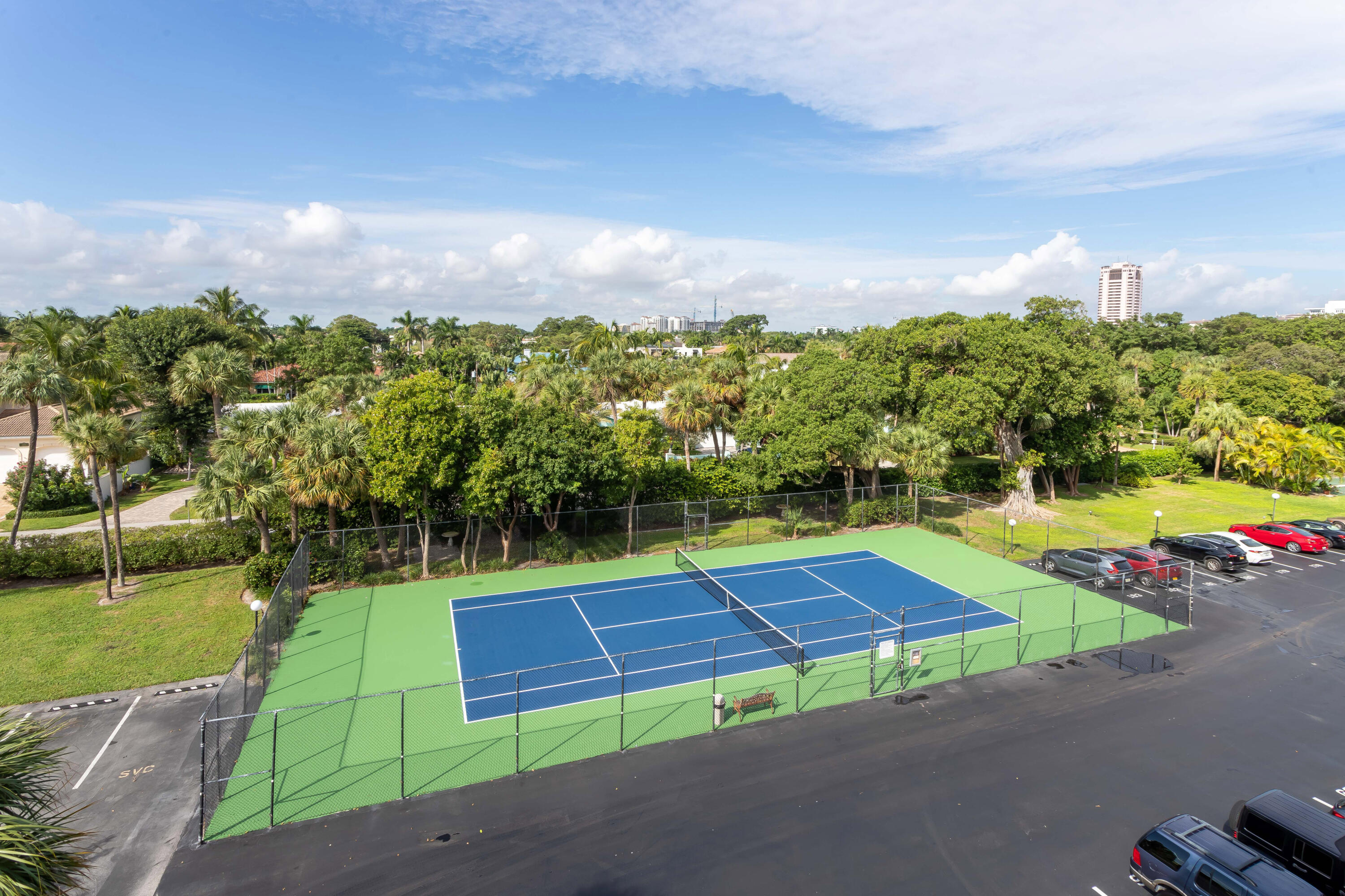 951 De Soto Road, Unit 2300 Boca Raton, FL 33432 - Photo 25 of 29 an aerial view of a tennis ground with large trees