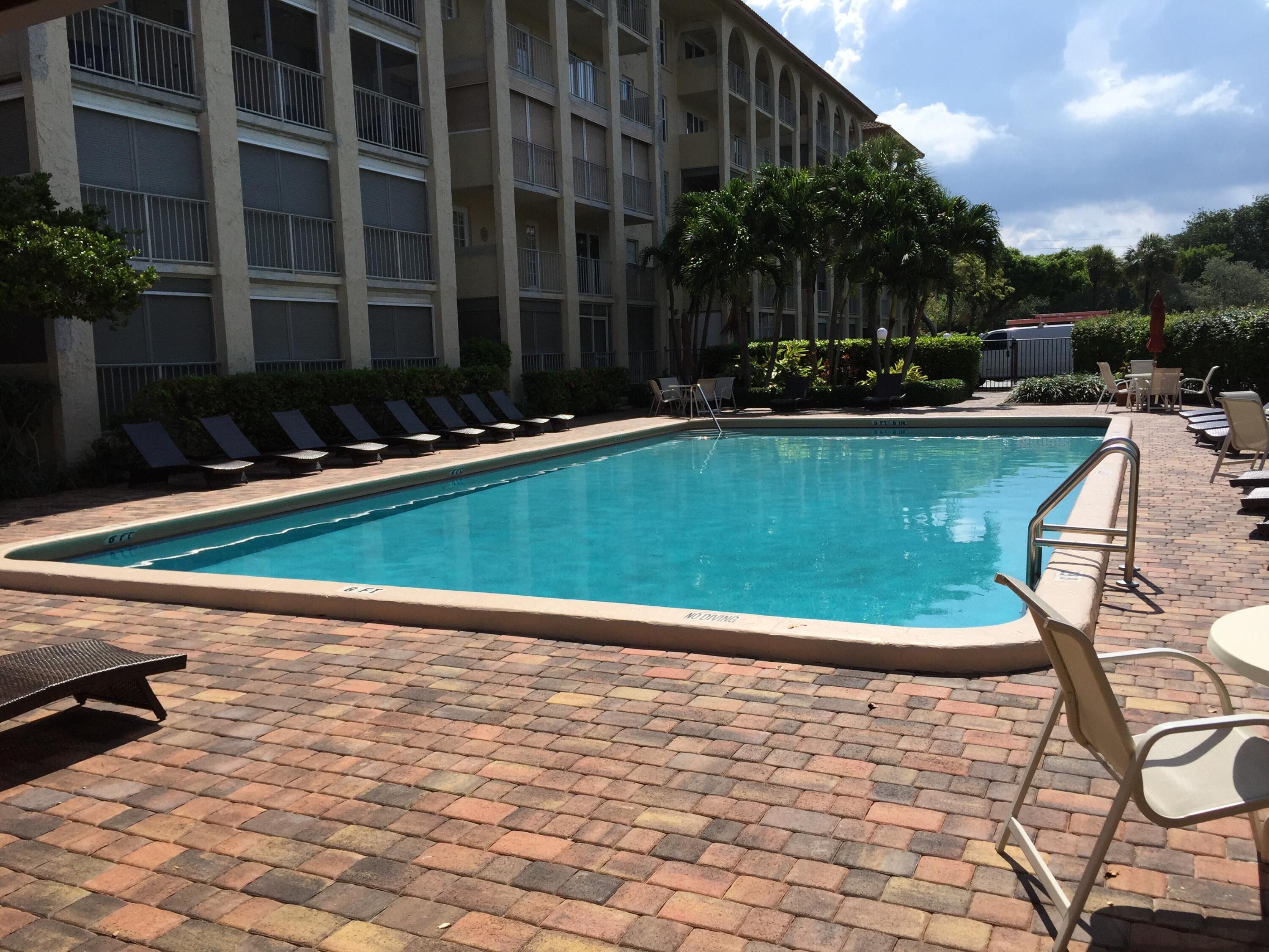 951 De Soto Road, Unit 2300 Boca Raton, FL 33432 - Photo 26 of 29 a view of swimming pool outdoor seating