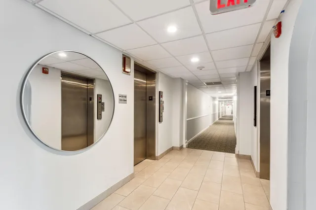 a kitchen with refrigerator and cabinets