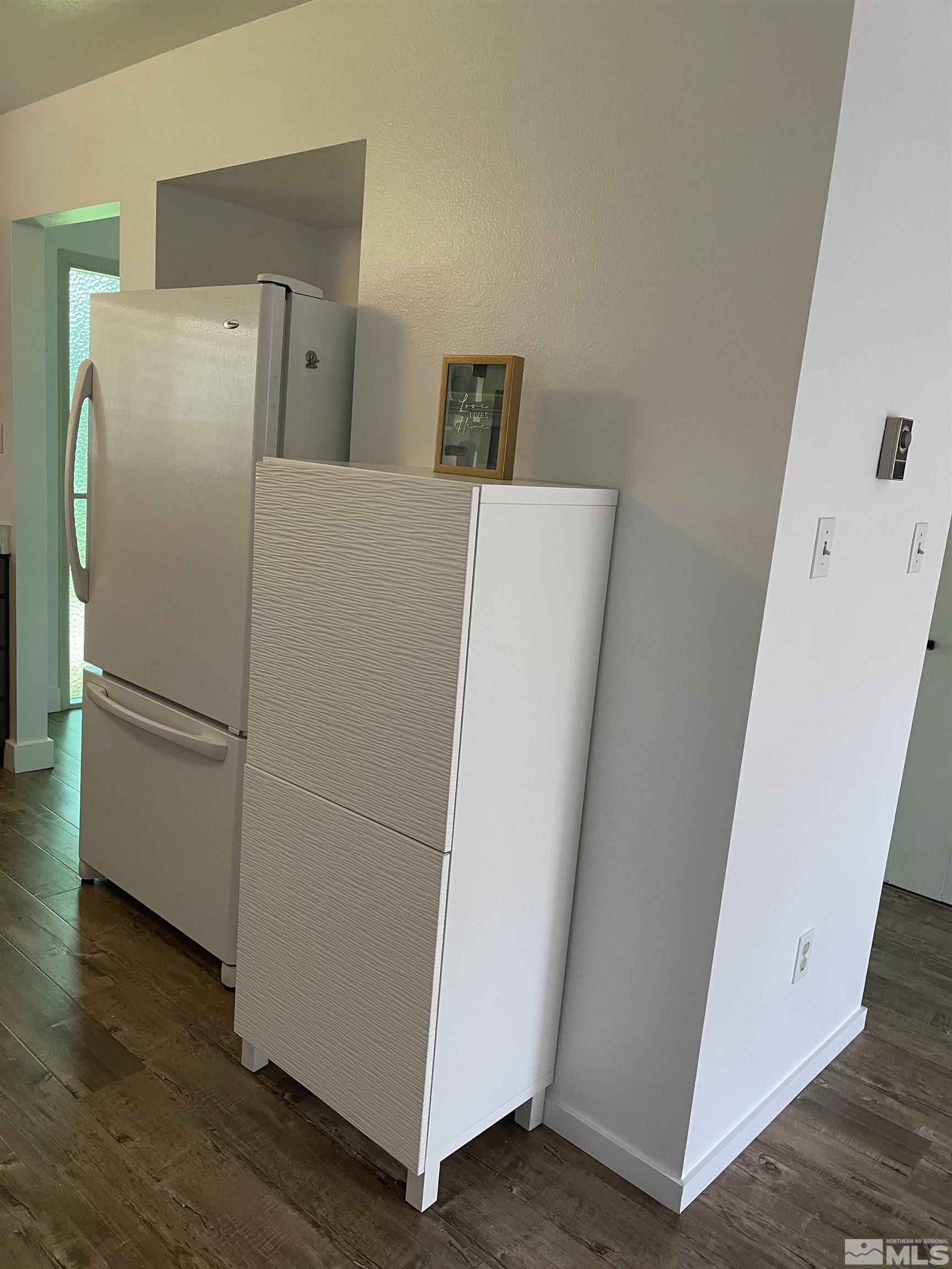 325 Smithridge Park Reno, NV 89502 - Photo 4 of 16 a white refrigerator freezer and a stove sitting inside of a kitchen