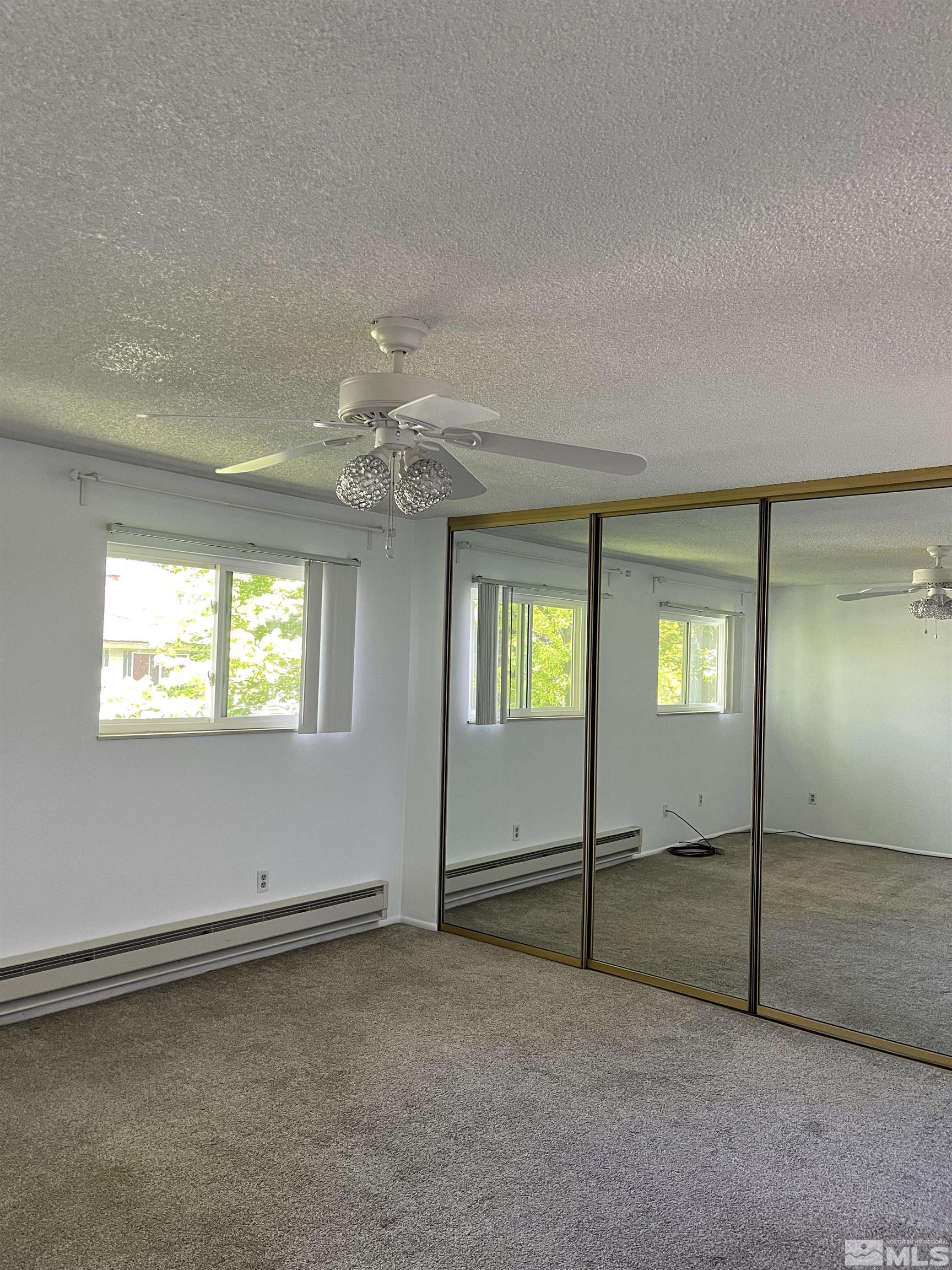 325 Smithridge Park Reno, NV 89502 - Photo 10 of 16 a view of an empty room with window and stairs