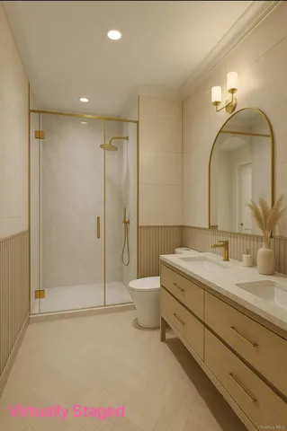 a bathroom with a double vanity sink mirror and toilet